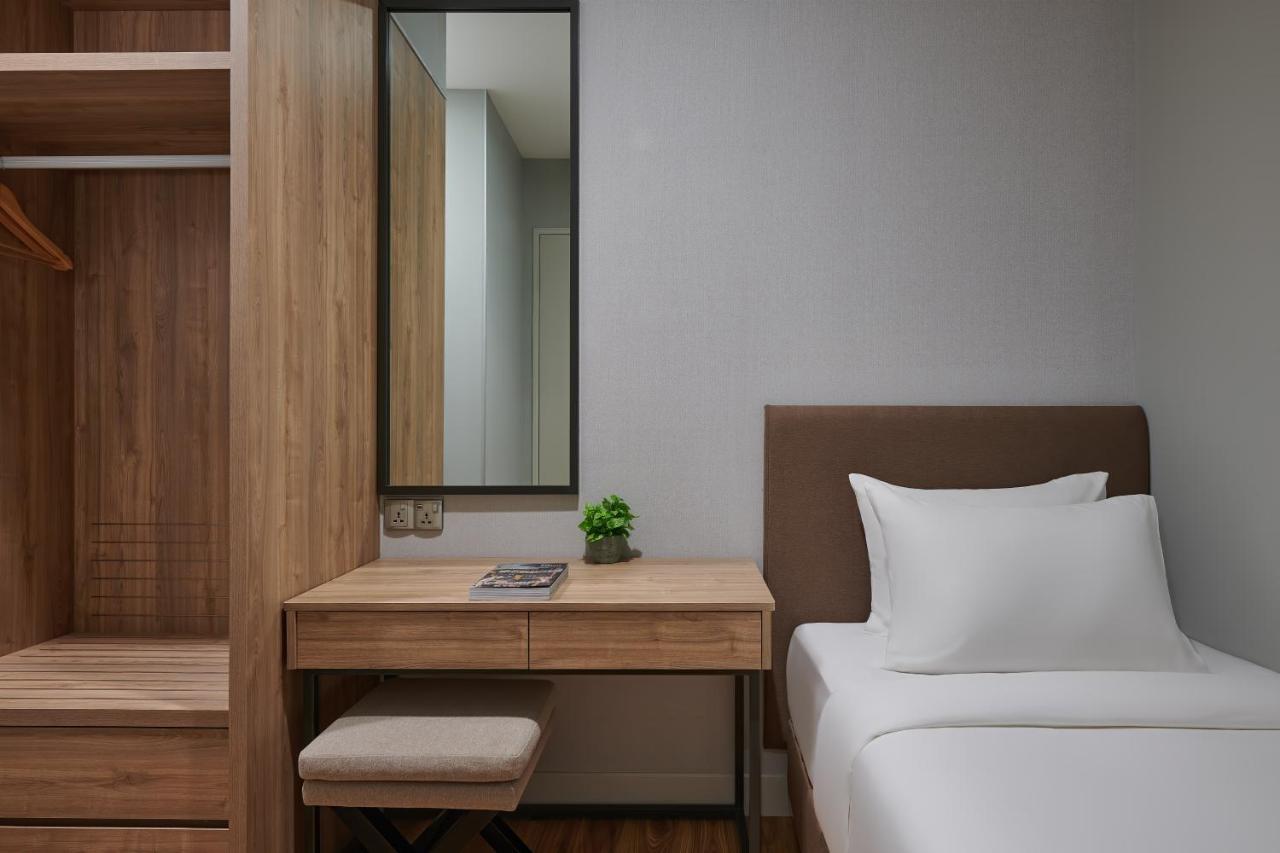 Mercure Living Putrajaya Buitenkant foto A bedroom at the hotel